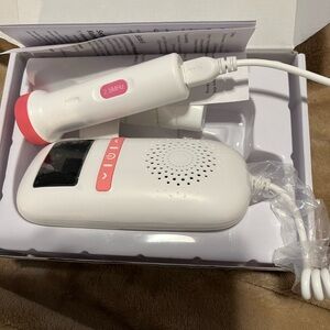White and Pink Fetal Heart Portable Doppler Device and ultrasound gel